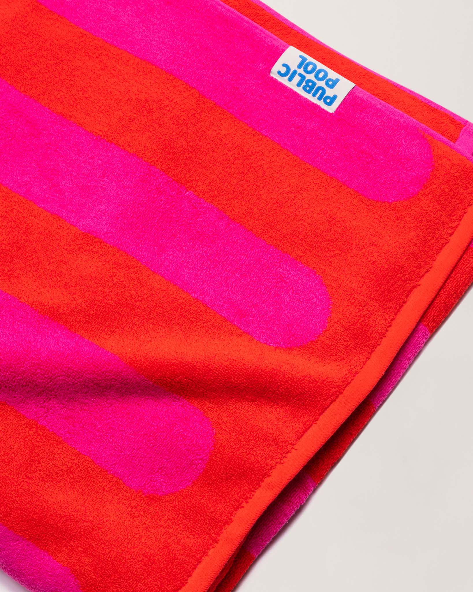 A folded red and magenta towel.