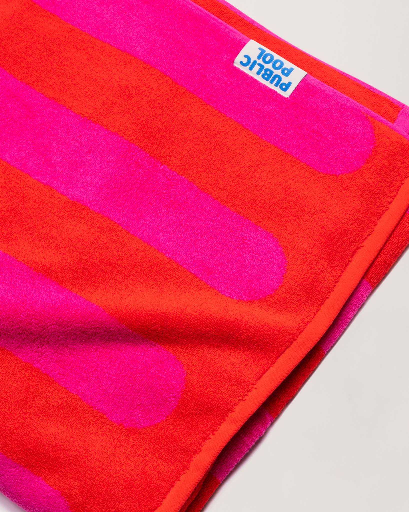 A folded red and magenta towel. 