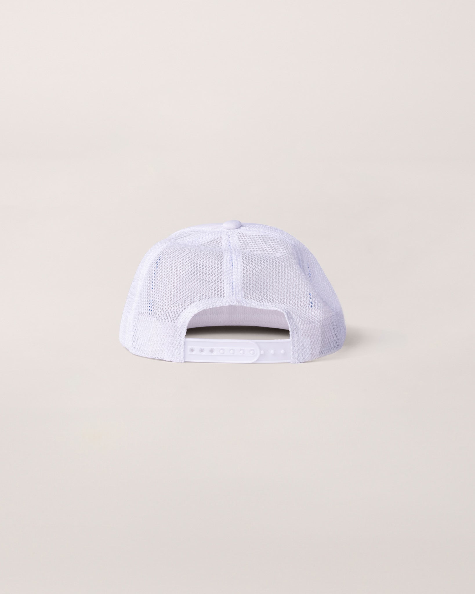 A view of the back of a white trucker hat. 