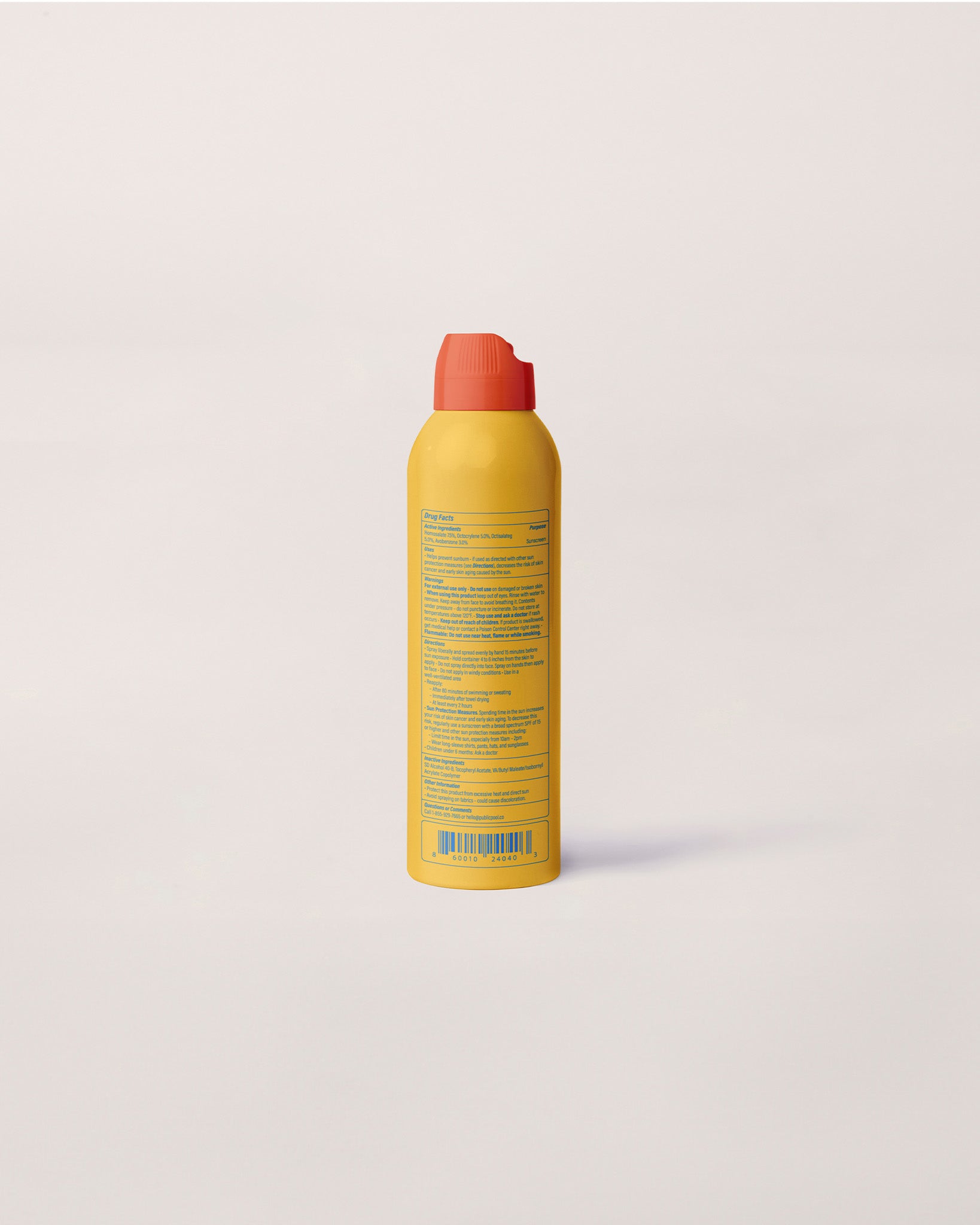 One side of a yellow sunscreen bottle. 